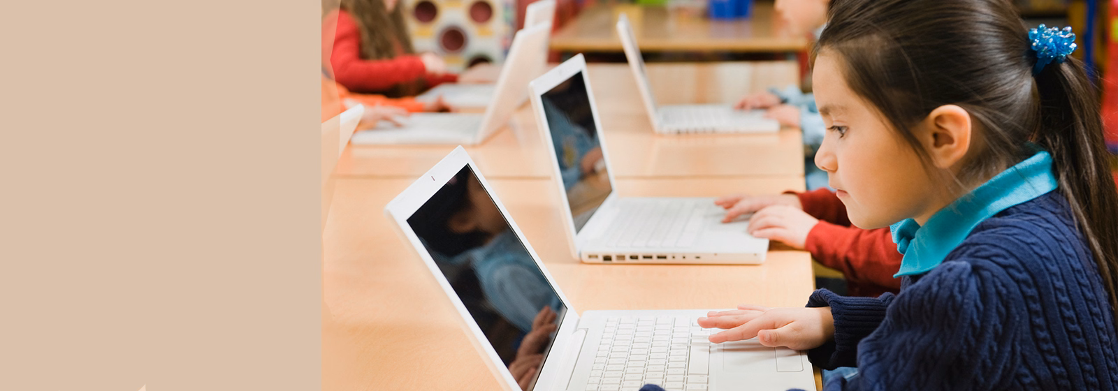 Young student using a laptop for digital learning in the classroom