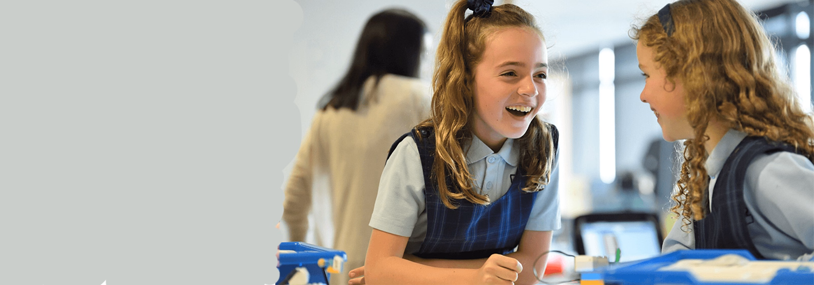 School students collaborating and learning together in a modern classroom